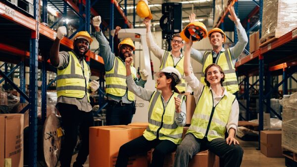 Professional Warehouse Worker Team Celebrating Success In Warehouse Factory