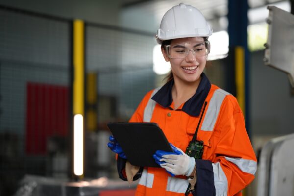 Professional Female Engineer In Hard Hat And Safety Glasses