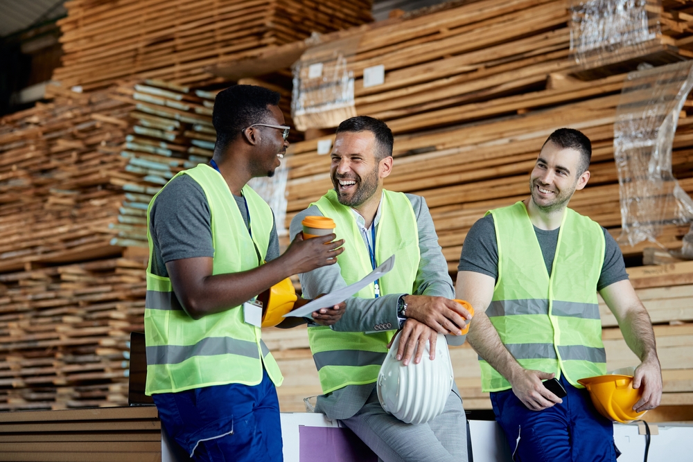 Happy Workers Having Fun While Talking With Their Manager