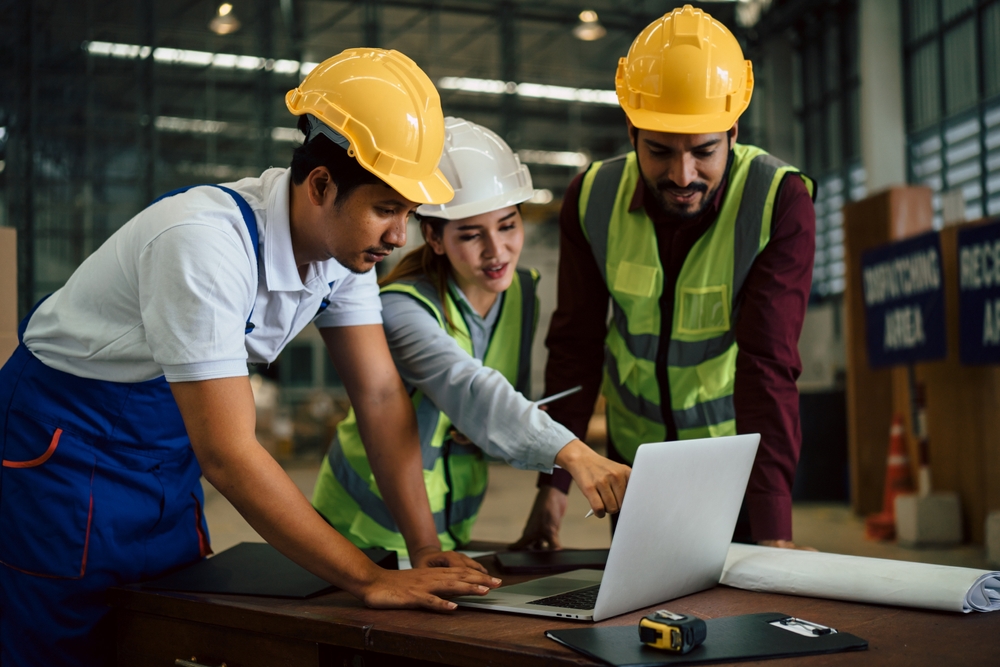 Group Of Industrial Workers Have Meeting To Brainstorm