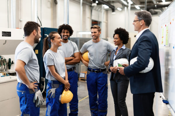 Young Happy Female Worker And Her Colleagues Communicating With Company